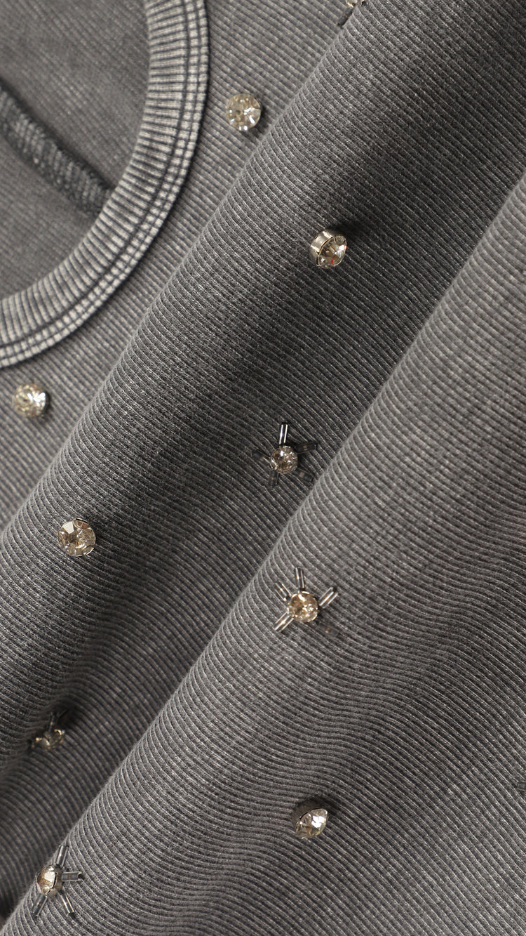 Close-up of a gray fabric with rhinestones