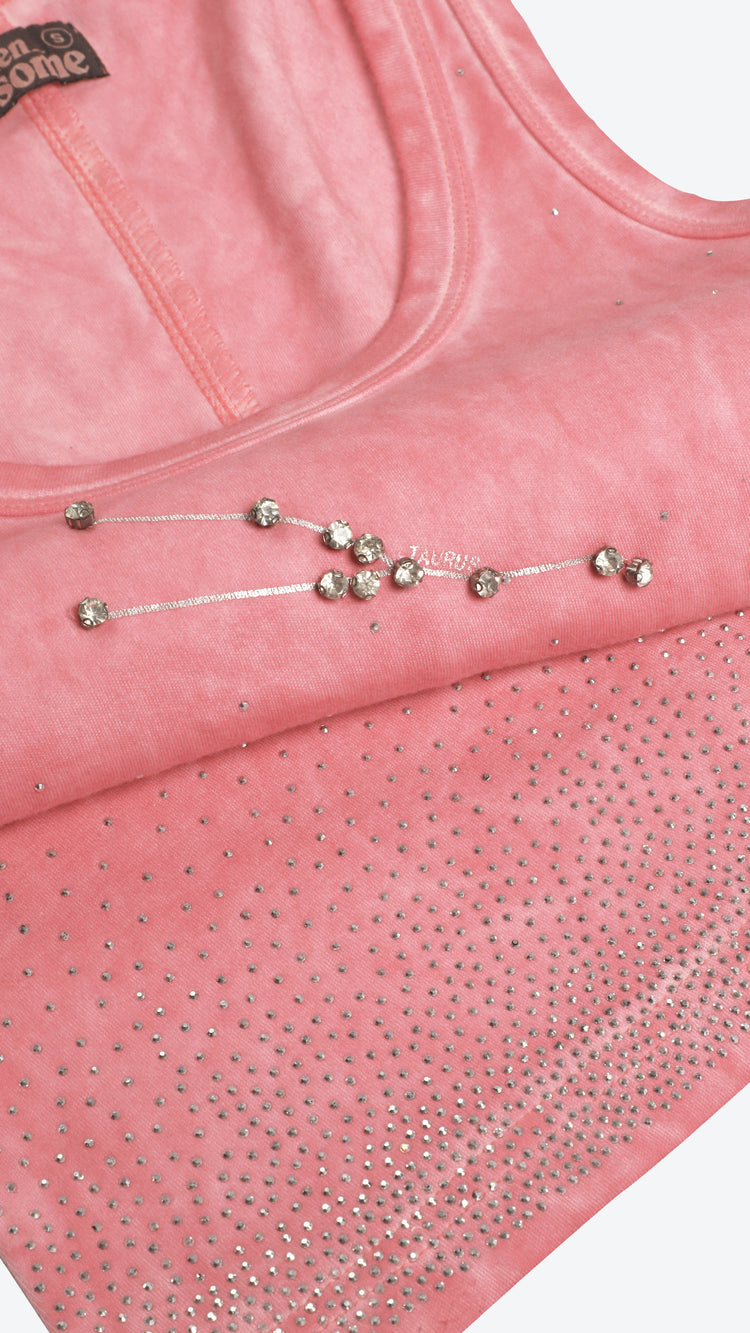 Pink tank top with rhinestone embellishments on a white background