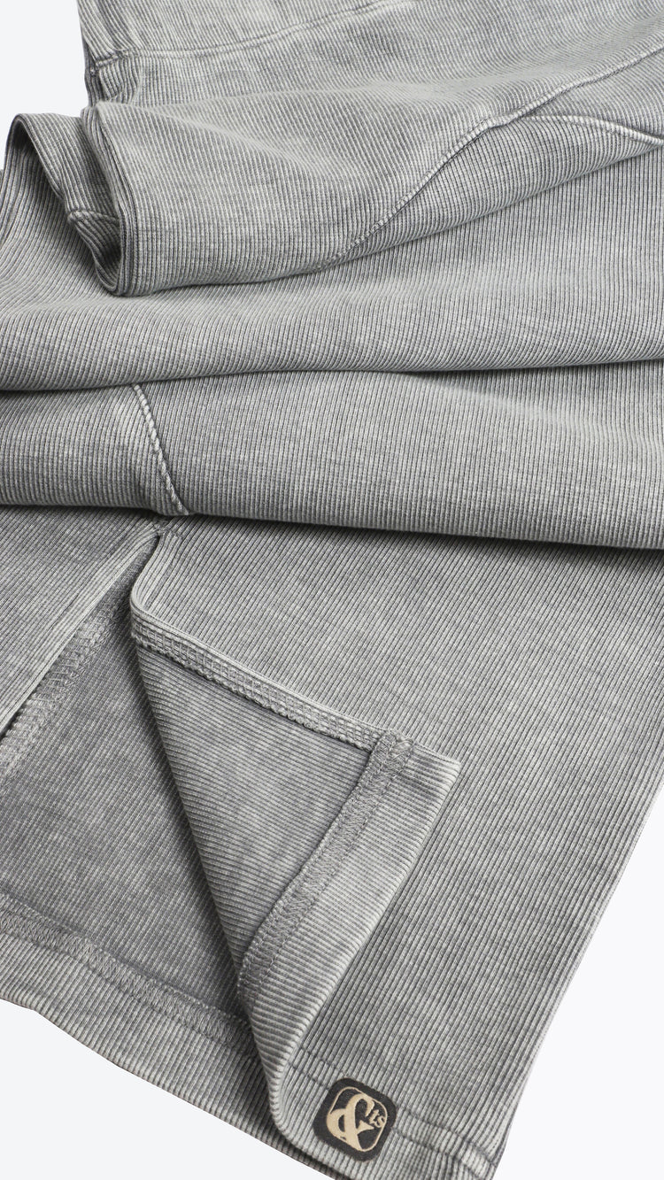 Folded gray fabric with a brand logo on a white background