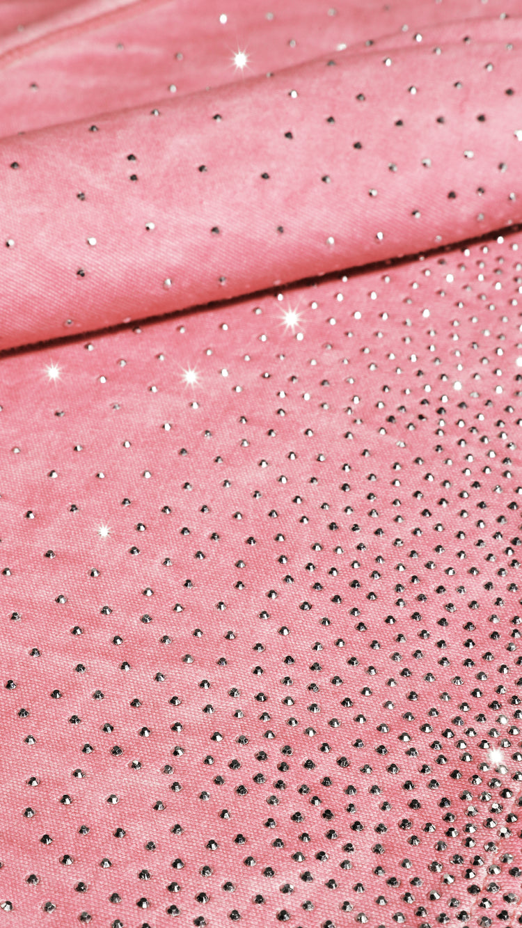 Close-up of pink fabric with embedded rhinestones