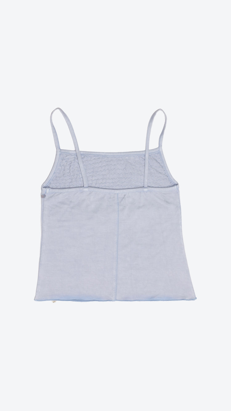 Back of a light blue camisole top with thin straps on a white background