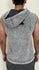 Person wearing a sleeveless gray hoodie against a plain background