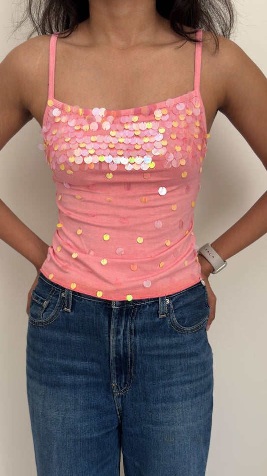 Model wearing peach sequined camisole