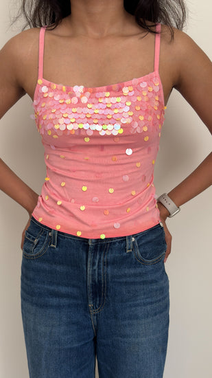 Model wearing peach sequined camisole