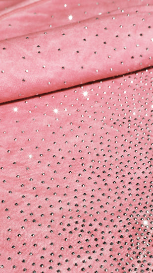 Close-up of pink fabric with embedded rhinestones