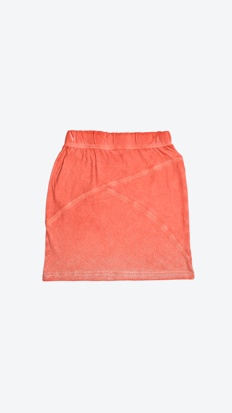 Back of a shell pink skirt on a white background