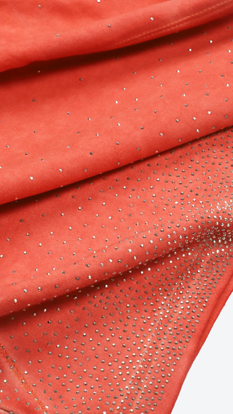 Shell pink fabric with a rhinestone pattern on a white background